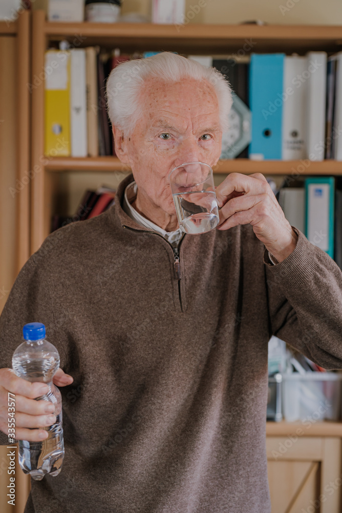 Portrait elderly man drinking water Portrait elderly man drinking water