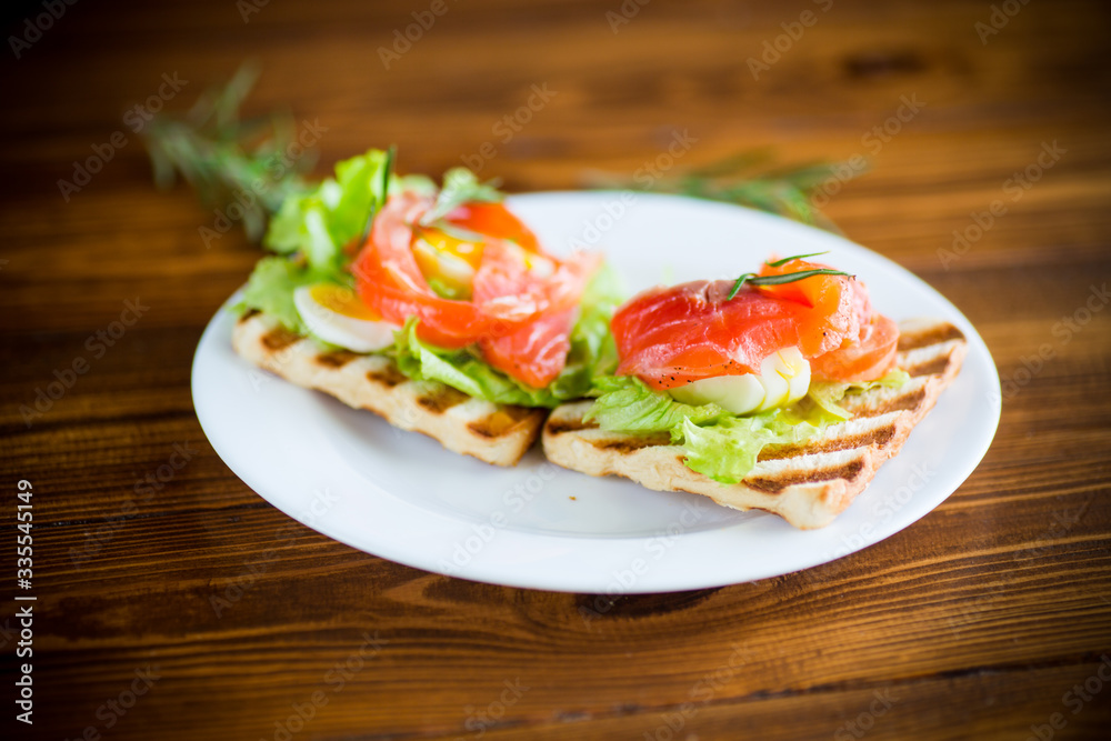 fried bread toast with salad leaves and salted red fish fried bread toast with salad leaves and salted red fish