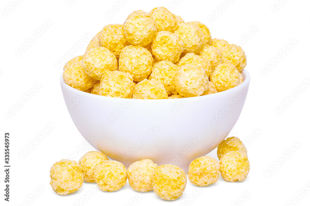 Crunchy yellow corn balls breakfast cereals in bowl Photos | Adobe Stock