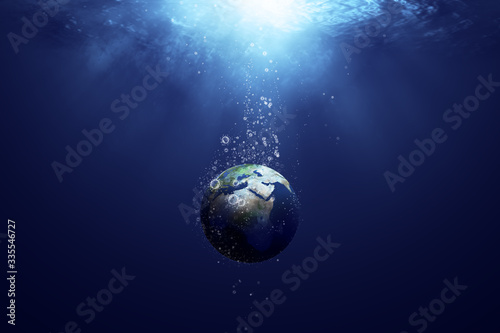Fototapeta Naklejka Na Ścianę i Meble -  globe sinking in the deep sea, with the bubbles in coronavirus shape, idea, conceptual images.