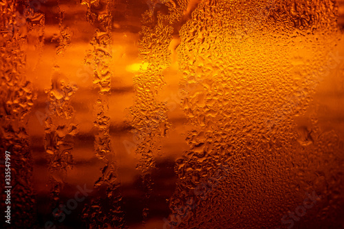  PhotosSearch by imageClose up view of the ice cubes in dark cola background. Texture of cooling sweet summer's drink with foam and macro bubbles on the glass wall. Fizzing or floating up to top o
