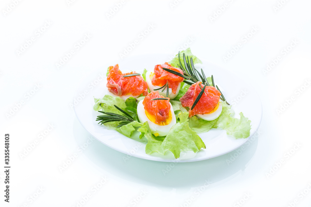 boiled eggs with salted red fish and salad leaves boiled eggs with salted red fish and salad leaves