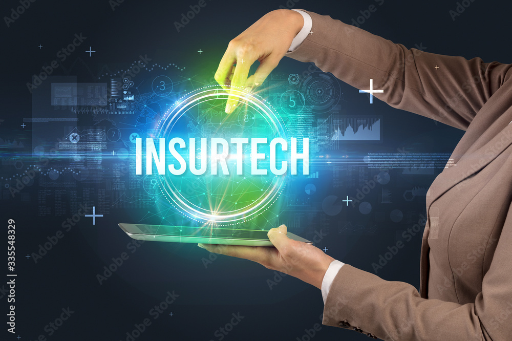 Close-up of a touchscreen with INSURTECH inscription, new technology concept Close-up of a touchscreen with INSURTECH inscription, new technology concept