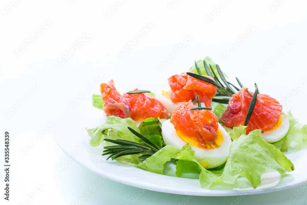 boiled eggs with salted red fish and salad leaves boiled eggs with salted red fish and salad leaves