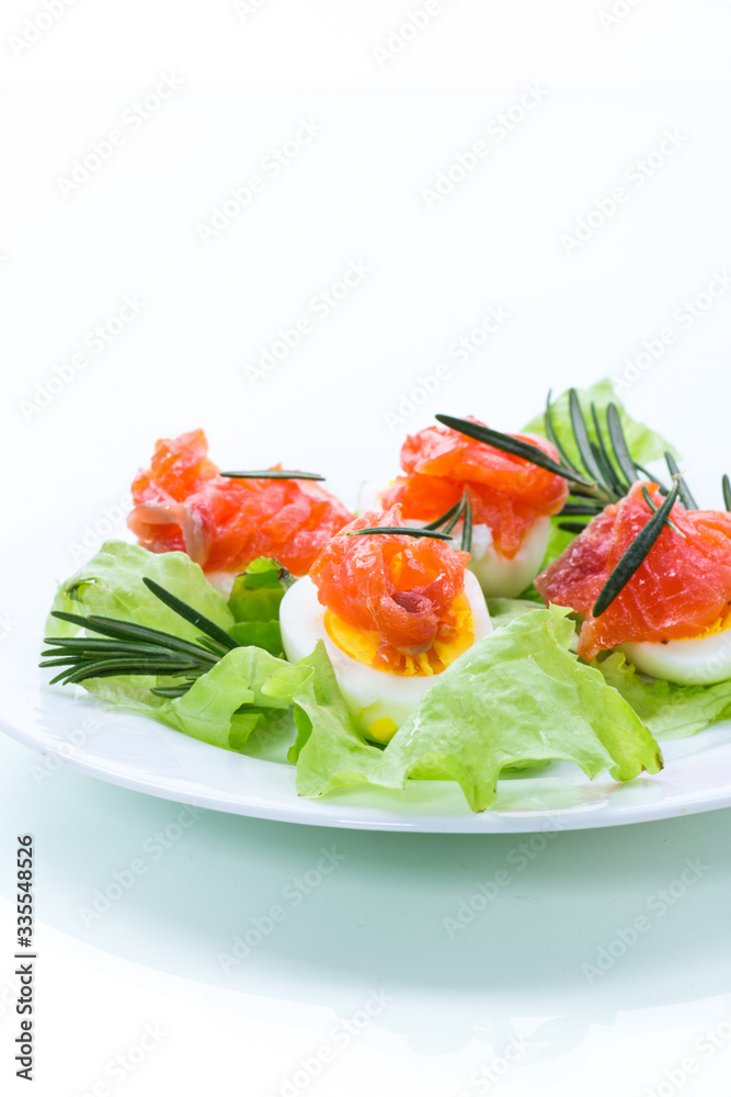 boiled eggs with salted red fish and salad leaves boiled eggs with salted red fish and salad leaves