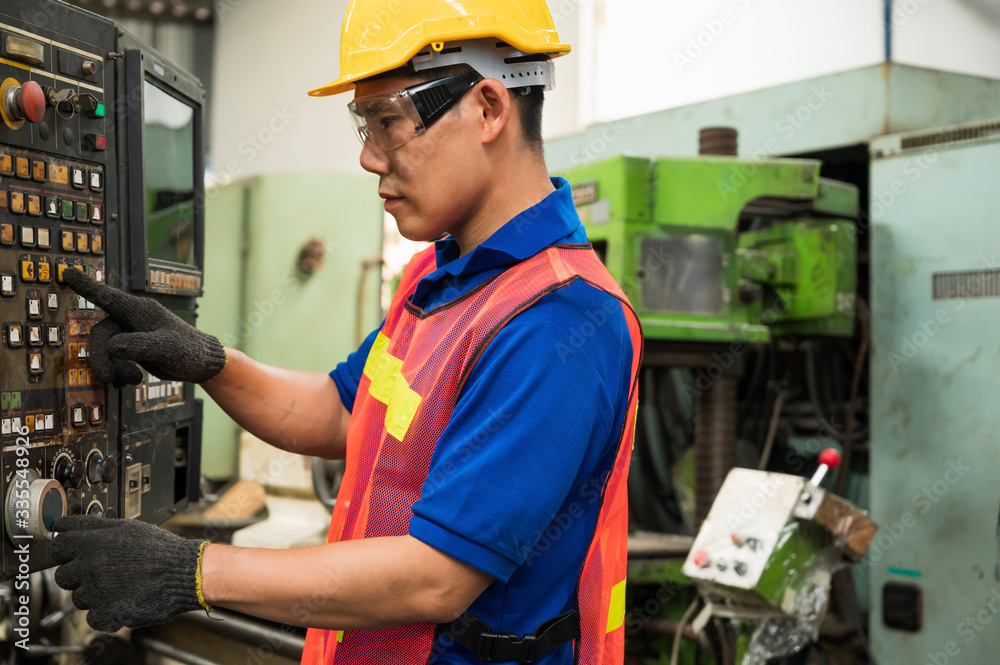 Asian Industrial workers are working on projects in large industrial plants with many devices. Asian Industrial workers are working on projects in large industrial plants with many devices.