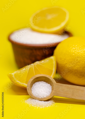 Citric acid on a yellow background. Selective focus. photo