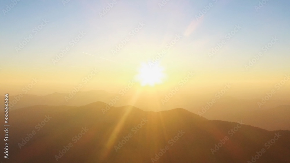 Close up wonderful morning sunrise natural flying through the clouds above mountain tops sunshine sunset sky sun sunny environment forest travel view scene peak weather