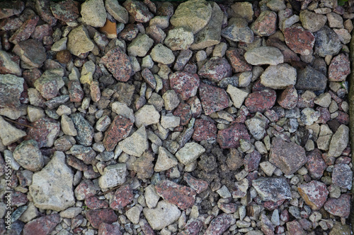 Crushed stone and multi-colored stones close-up element for the designer. Background like texture..