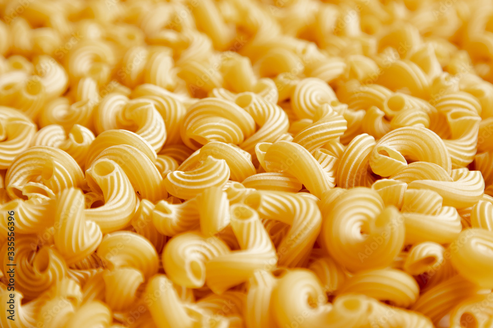 Italian pasta laid out on a white background. Background from pasta, isolate. Concept - food stocks during the covid-19 epidemic Italian pasta laid out on a white background. Background from pasta, isolate. Concept - food stocks during the covid-19 epidemic