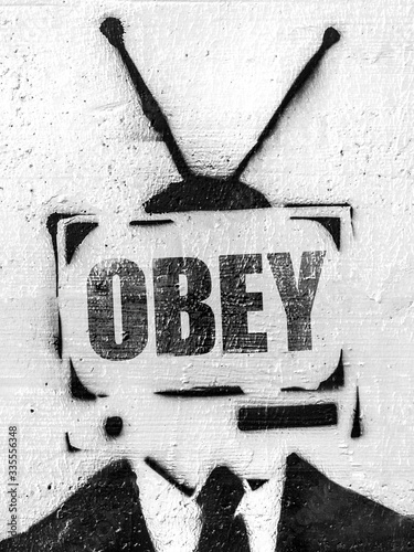 TV head with message OBEY