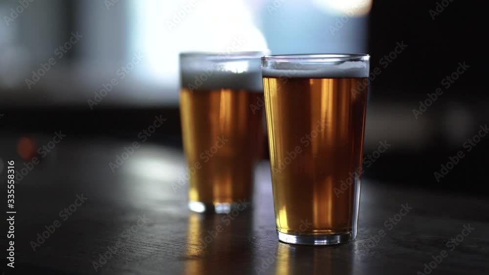 two pints of beer with rising bubbles two pints of beer with rising bubbles