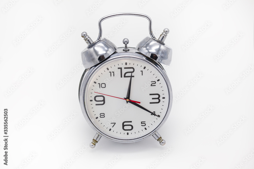 Analog alarm clock metallic color, isolated. Analog alarm clock metallic color, isolated.