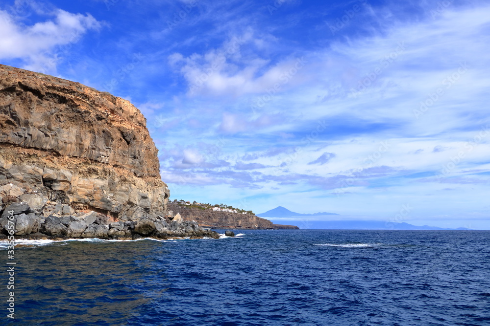 Rocky cliffs on the shore on the coast of La Gomera Island, Canary Islands in Spain Rocky cliffs on the shore on the coast of La Gomera Island, Canary Islands in Spain