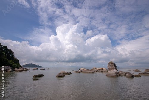 Coastal rock beside the beach at Permatang Damar Laut, Penang. photo