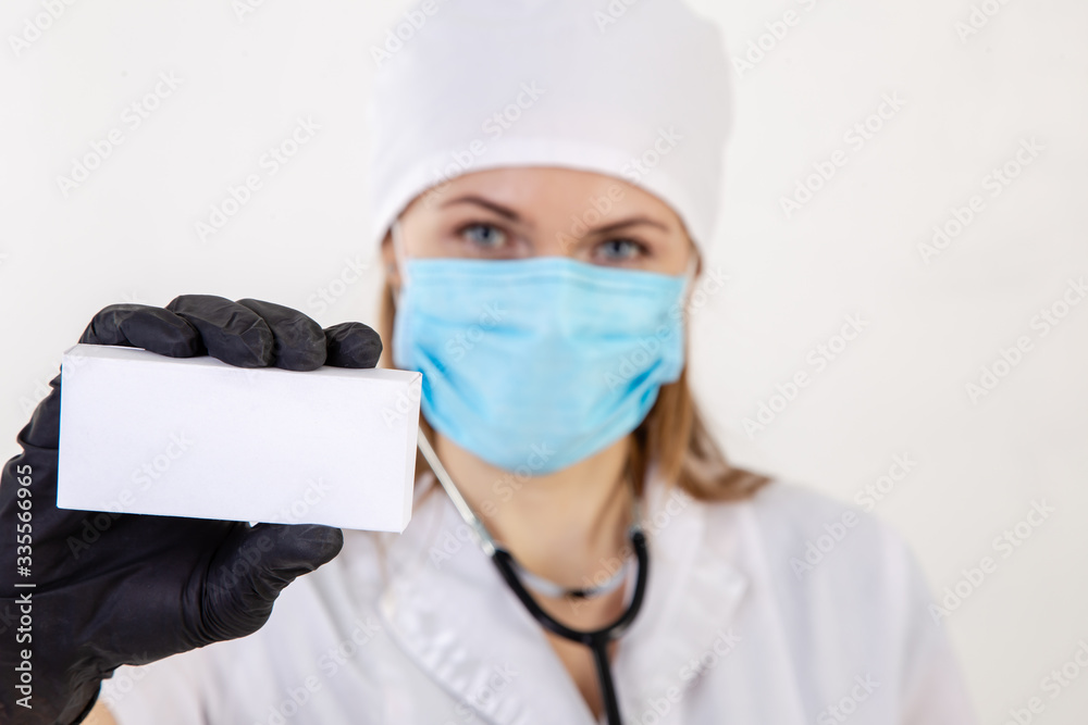 Doctor in a white coat holds a box. Doctor in a white coat holds a box.
