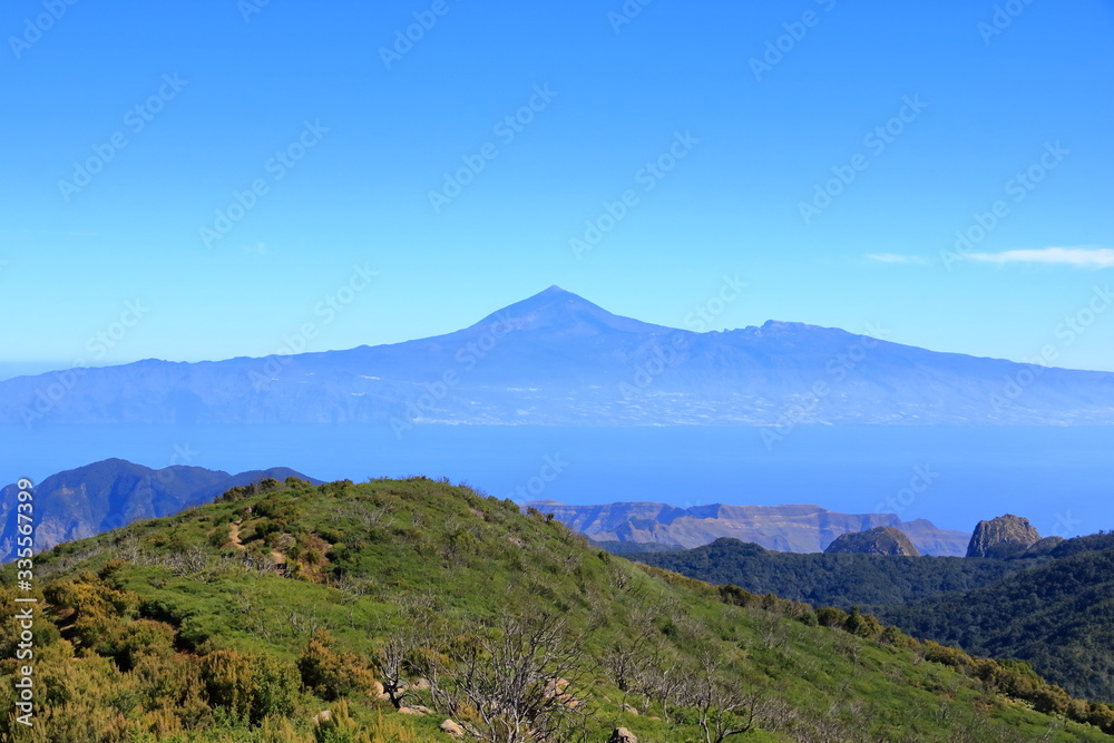 View over the national park Garajonay on La Gomera. In the background the island Tenerife with the Volcano Pico de Teide