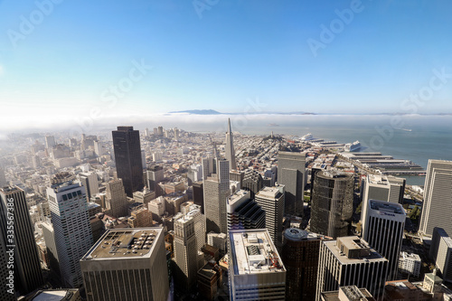 The view of downtown San Francisco with blue sky and clouds rolling in.