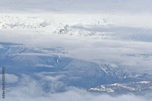 top view of clouds over mountain landscape © Aleda