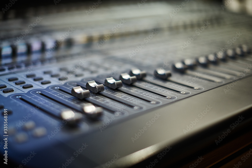 Fader buttons on a professional audio mixing console