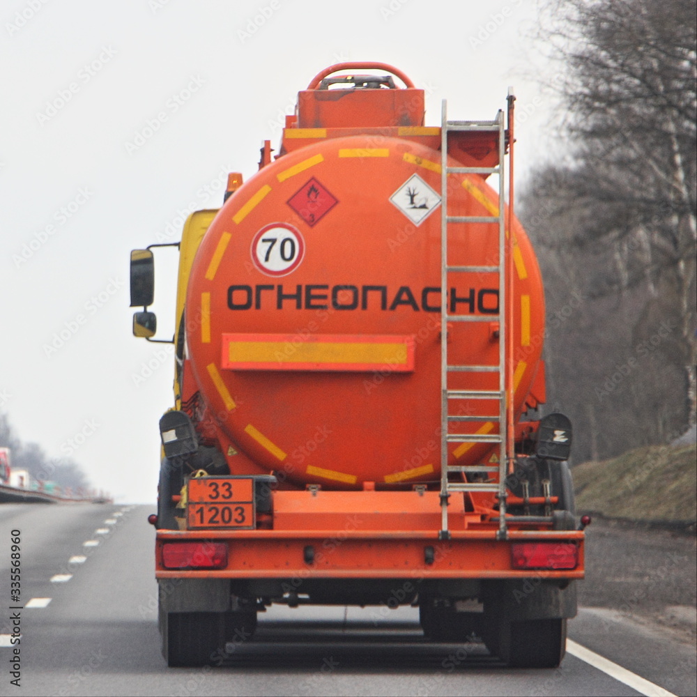 Fuel truck with new bright orange barrel with 33 1203 dangerous class