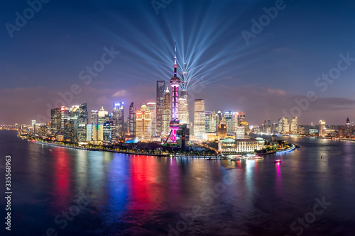 Pudong skyline with lightshow at night, Shanghai, China photo