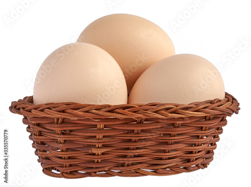 Wallpaper Mural chicken eggs in a basket, isolated on a white background Torontodigital.ca