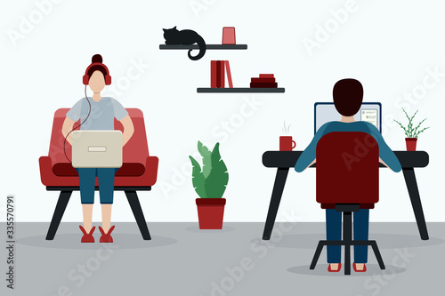 Girl in red headphones and guy with a laptops works from home. Girl on a red armchair and her boyfriend at the work table. Quarantine. Stay at home. Freelancer. Couple in isolation in the flat