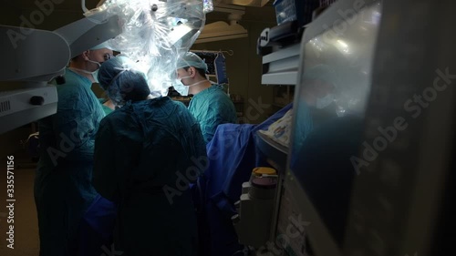 The team of doctors focuses on the patient during the operation in the hospital