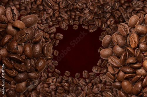 Close up. Tornado of coffee beans. Top view. On brown background