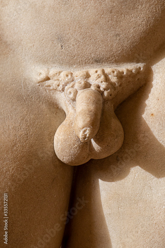 male genitals on marble statue