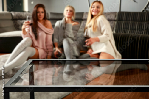 Table background of free space and home interior with girls. 