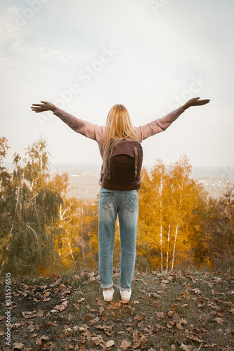 Happy Woman Stands On Mountain Outstretched Her Arms
