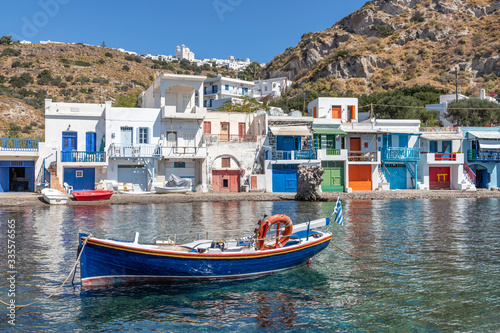 Boat Coloured houses in Klima beach with Trypiti village in background
