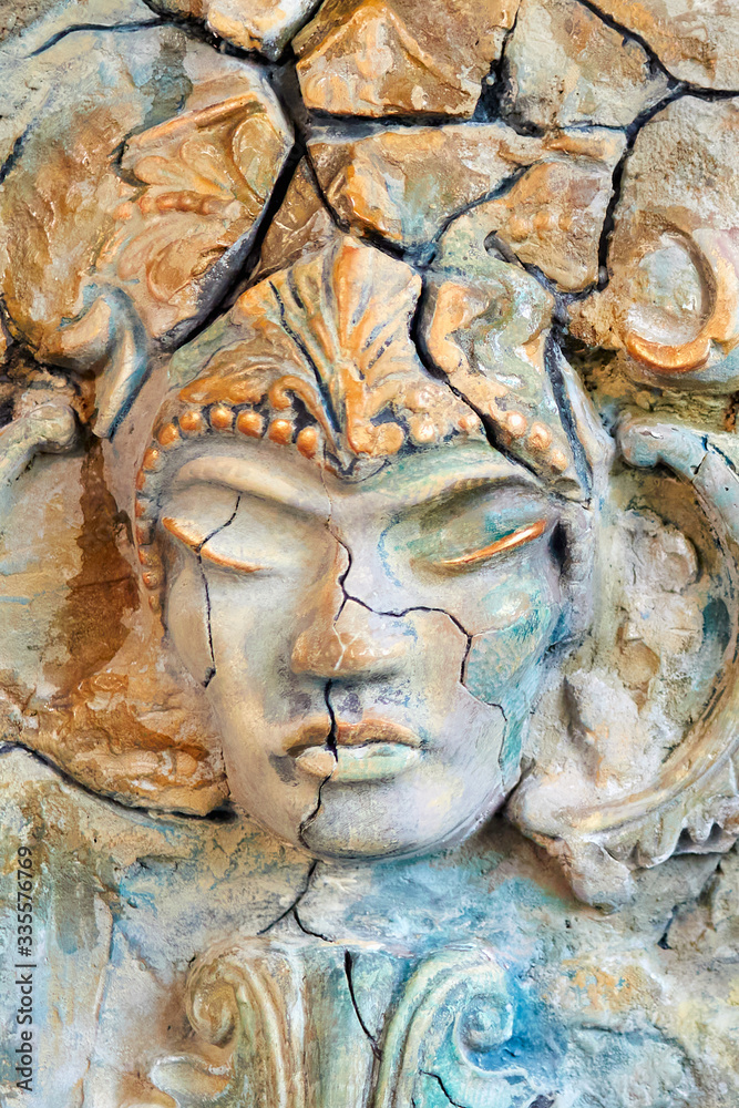 Beautiful stone face sculpture with a closed eyes Beautiful stone face sculpture with a closed eyes