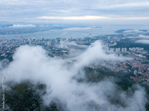 Aerial view sea cloud move toward Penang George Town in cloudy morning.