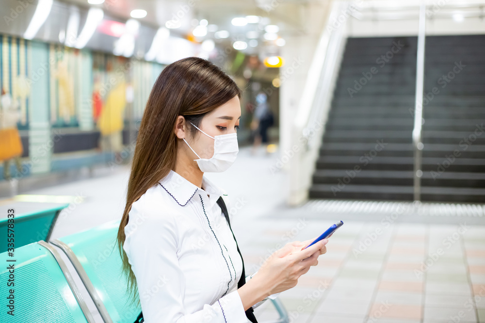 woman with mask in station