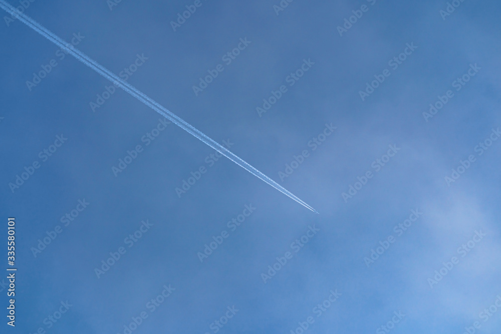 White stripes on the sky from the plane White stripes on the sky from the plane