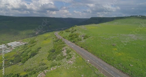 Aerial shot above Golan Heights and Taiberia in North of Israel. Open fields with green landscapes and mountains above Galilee sea or Kinnert at Jordan valley  photo