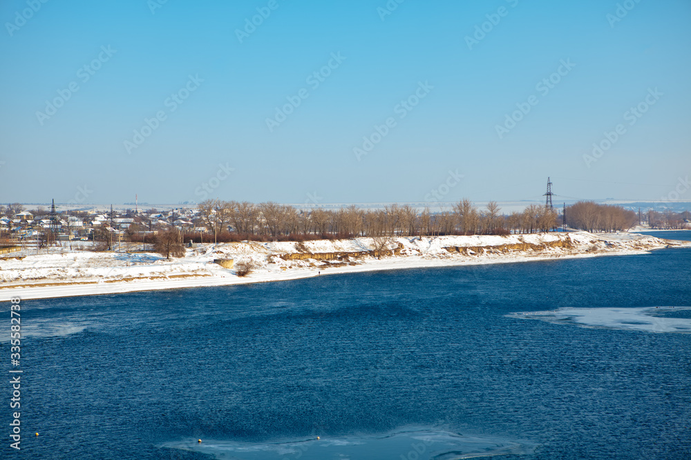 early spring scenery with melting ice on the  river