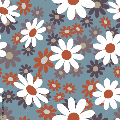 Cute abstract seamless pattern with small colorful chamomile flowers on the gray background.