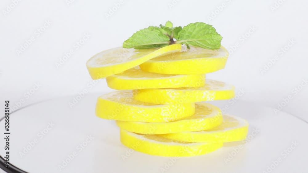 Heap of sliced fresh lemon fruit spinning on table Heap of sliced fresh lemon fruit spinning on table