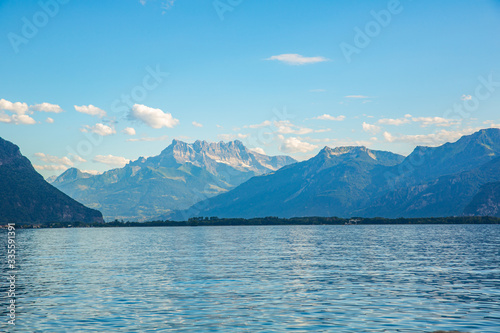 Lake Geneva peaceful panorama, water surface and Swiss alps on horizon