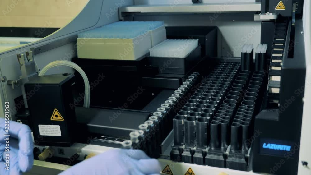 Test samples are getting loaded into a laboratory machine Test samples are getting loaded into a laboratory machine