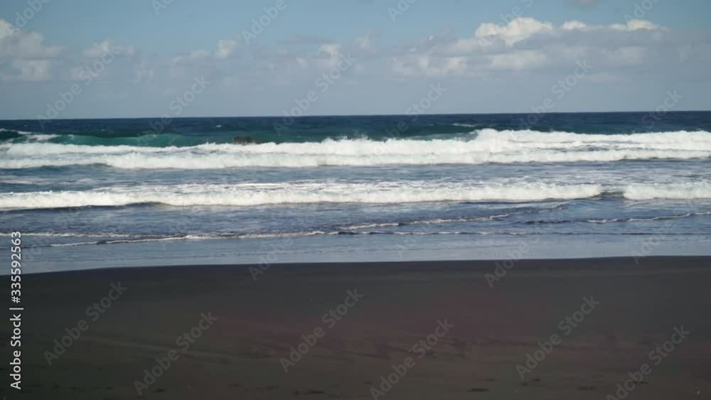 Sandy beach and waves of the Atlantic Ocean on the island of Tenerife Sandy beach and waves of the Atlantic Ocean on the island of Tenerife