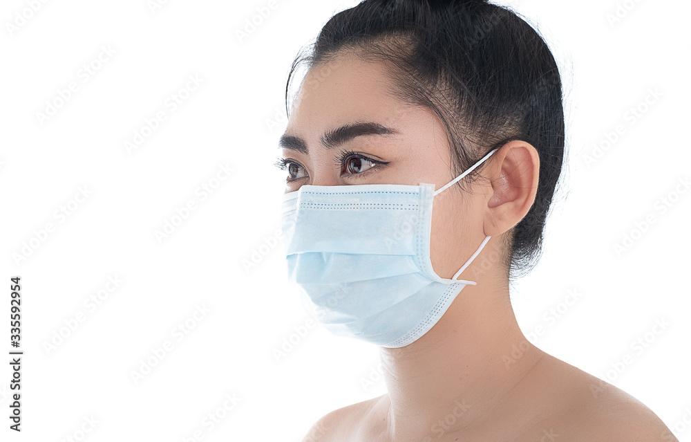 Beautiful young Asia woman putting on a medical mask to protect from airborne respiratory diseases as the flu covid-19 PM2.5 dust and smog, Women safety virus infection concept Beautiful young Asia woman putting on a medical mask to protect from airborne respiratory diseases as the flu covid-19 PM2.5 dust and smog, Women safety virus infection concept