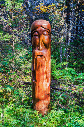 Wooden sculpture in the forest