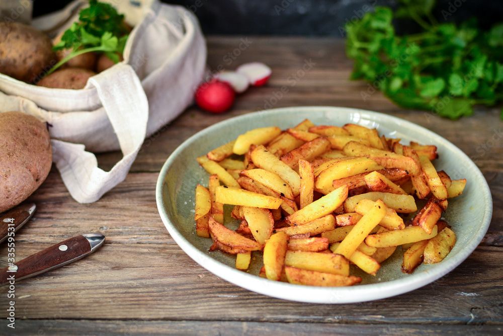 Step by step cooking. Fried potato recipe. Wood background. Dishes from potatoes. Step by step cooking. Fried potato recipe. Wood background. Dishes from potatoes.