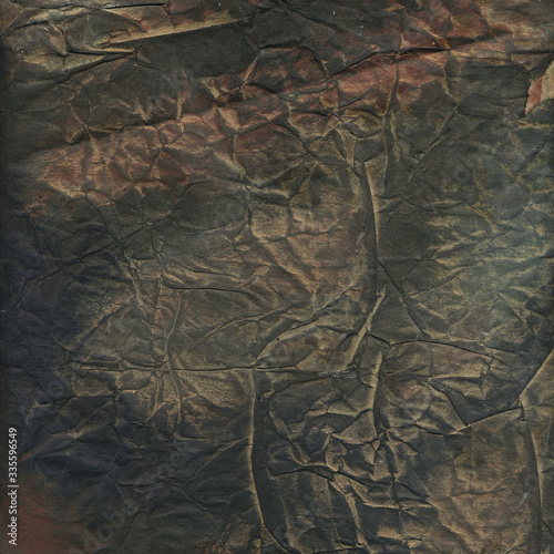 Old crumpled paper background with dirty grunge texture and abstract rough peeling. Grunge textured backdrop.
