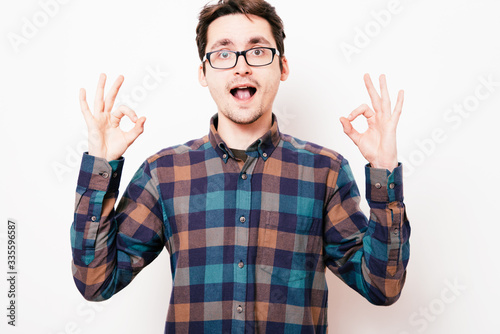 man shows gesture ok